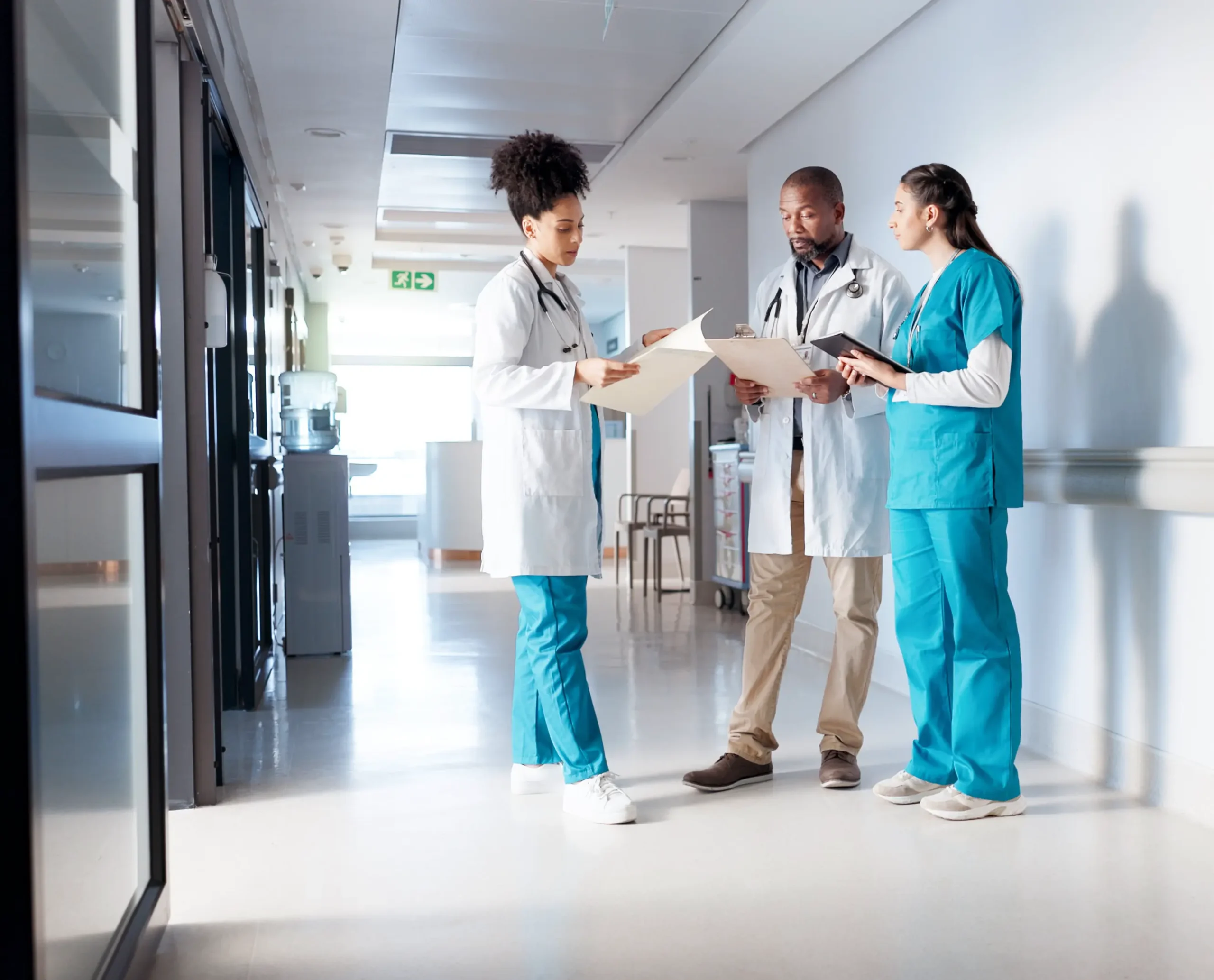 Doctors standing talking to each other
