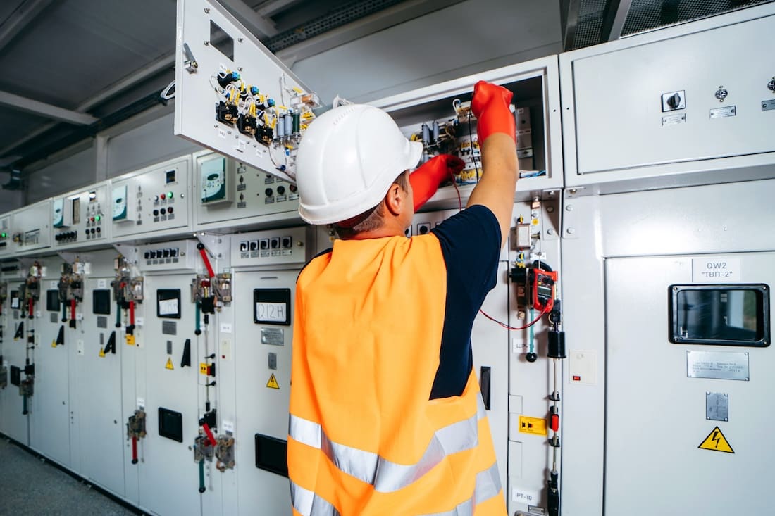 Man working on switchgear